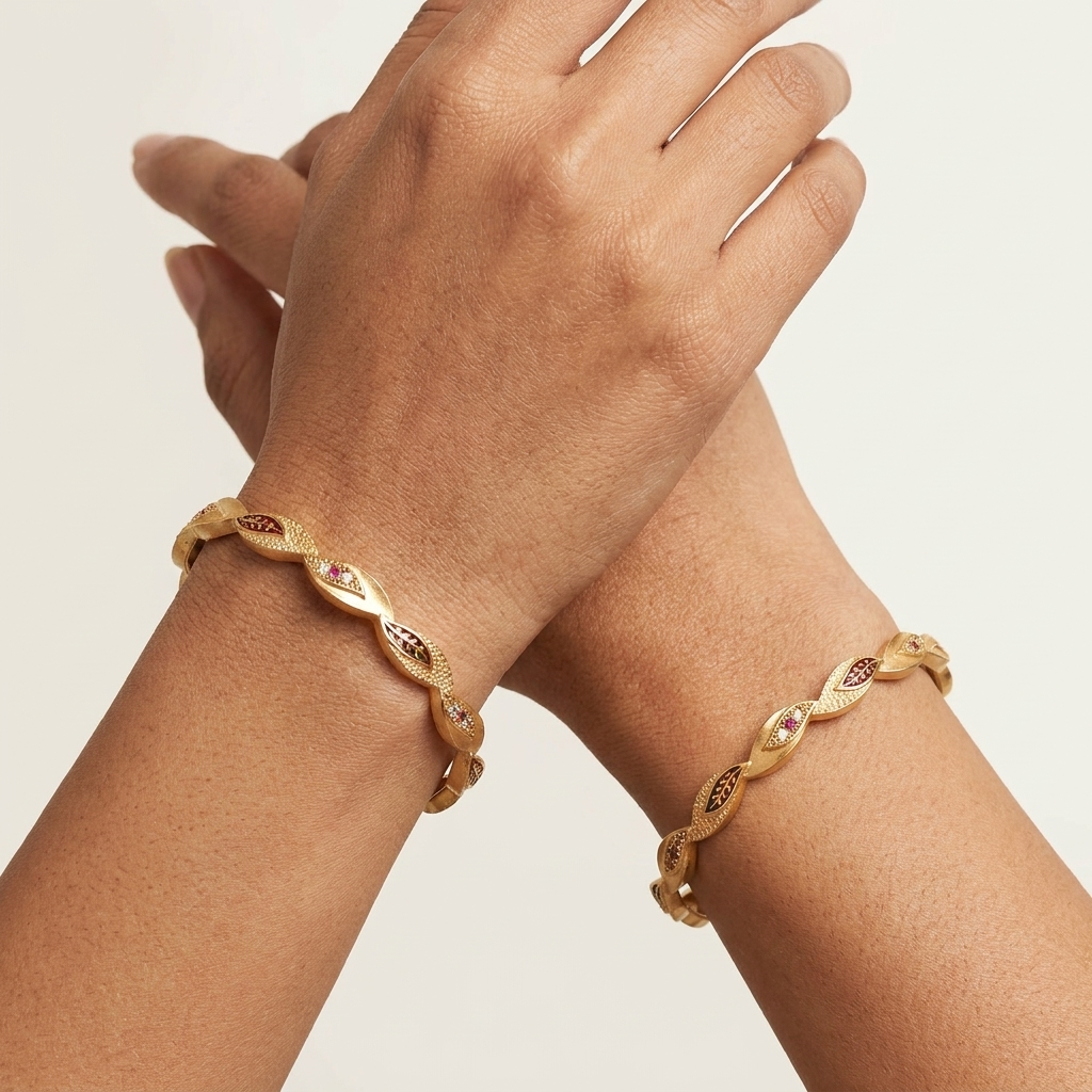 The Aura Leaf Wave Bangles (Set of 2) ÔøΩ Matte Gold with Ruby Accentuation