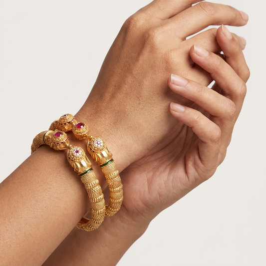 The Majestic Gaja Kada Set ÔøΩ Intricate Gold-Tone Elephant Motif Bangles (Set of 2)